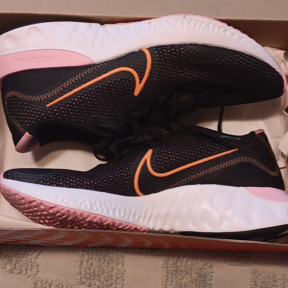 Nike "Renew"  size 9   womens running shoes. Navy blue pink and white sole